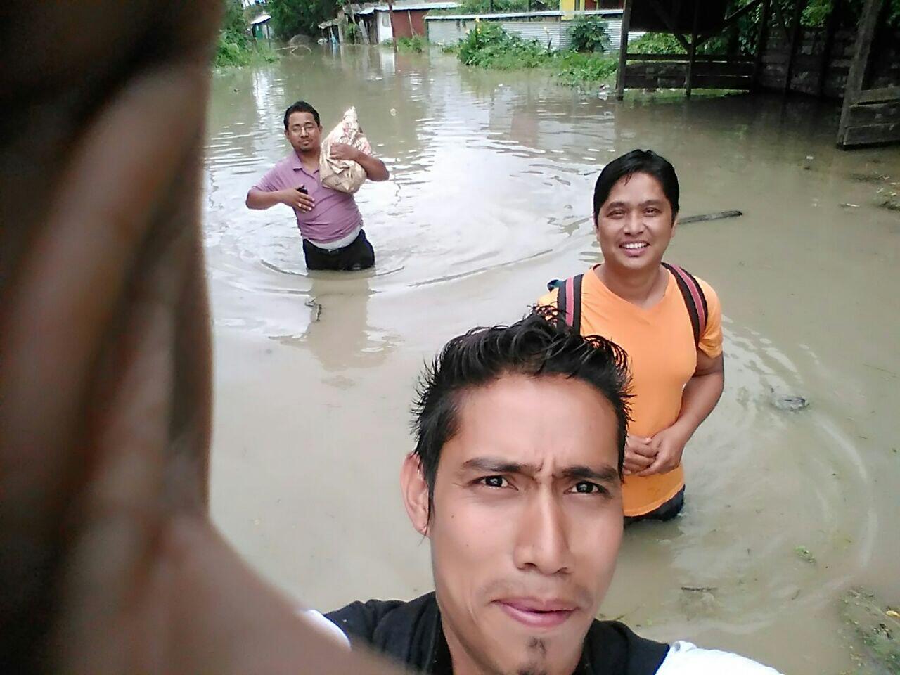 Helping the flooded village along with my team